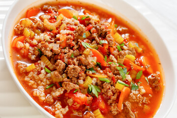 Hamburger Soup with barley and vegetables in bowl