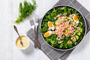 pink cocktail shrimps salad with veggies and eggs