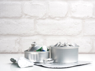 Aluminum waste on a white background, recycling concept, resources