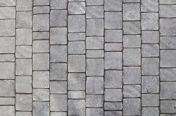 Paving slabs of gray color. Paving stones in walkway