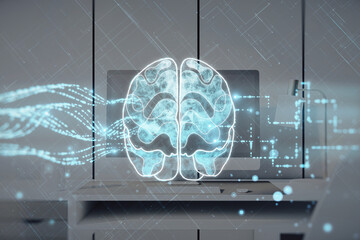 Creative glowing brain hologram on blurry office workplace with computer backdrop. Neurology research, artificial intelligence concept. Double exposure.