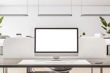 Front view on blank white monitor screen with place for your logo or text on workspace table in minimalistic style office with white interior design. 3D rendering, mockup