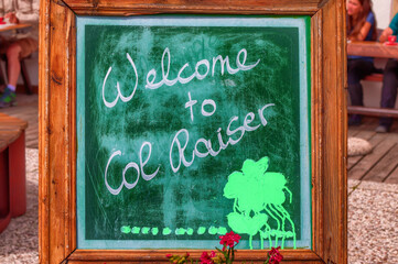 Blackboard with the word "Welcome to Col Raiser", locality in the South Tyrol, Italy