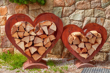 Pile of wood with wooden hearts