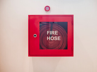 Fire hose reel on a white wall