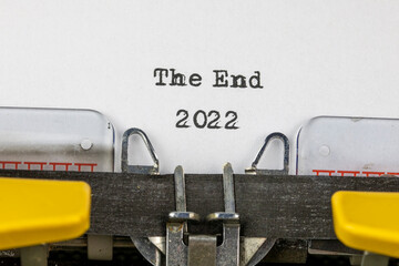 The End 2022 written on an old typewriter	
