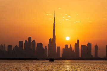 Oct 1st, 2022 - Dubai, UAE: The Dubai city skyline and Burj Khalifa silhouette