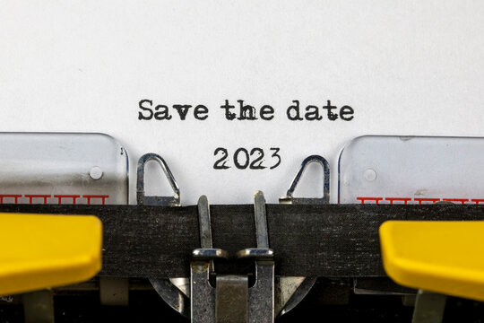Save the date 2023 written on an old typewriter	
