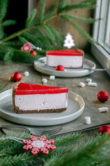 cheesecake New York slice with red jelly top. Christmas new year decorations,dessert holiday food.