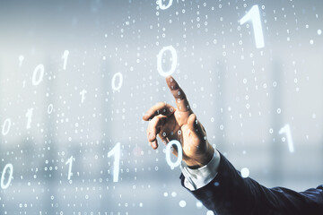 Male hand working with abstract virtual binary code sketch on blurred office background, hacking...