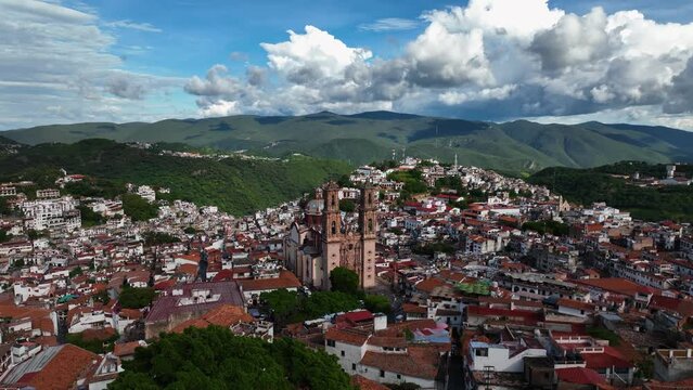 Aerial view around the Church of Santa Prisca de Taxco, sunny day in Mexico - orbit, drone shot