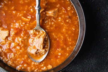kharcho red tomato soup, meat, rice cooking healthy meal food snack diet on the table copy space food background rustic top view