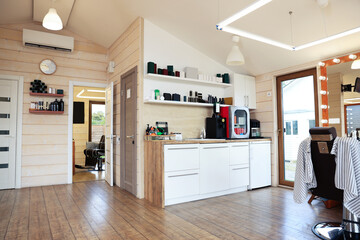 Stylish barbershop interior with professional hairdresser's workplace