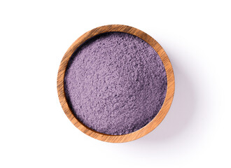 Purple powder in wooden bowl isolated on white background. Top view. Flat lay.