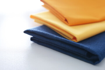 Different colorful napkins on white table, closeup