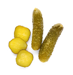 Tasty sliced and whole pickled cucumbers on white background, top view