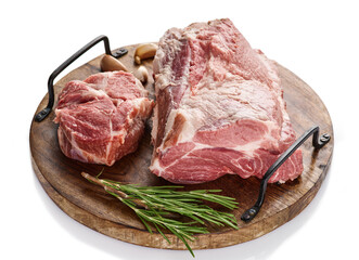 Raw pork neck meat on wooden board. Chop steak. White background
