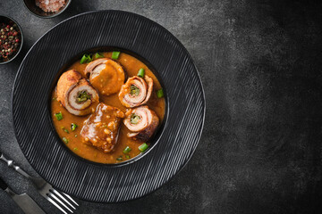 Pork roulade with pickles and bacon, served with demiglace meat sauce