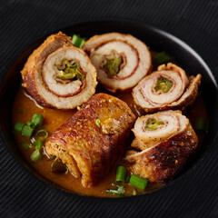 Pork roulade with pickles and bacon, served with demiglace meat sauce