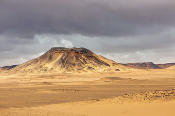 View of the Black and White Desert before a thunderstorm. Baharia. Egypt