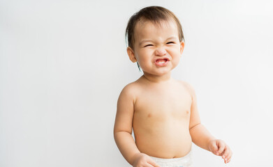 The little boy made a gesture cheerful and lively. Child funny face laughing on white isolated background. Son is so cute and funny. Family relationships concept