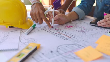 Builder blueprint, engineering and architecture of a team development project in a office. Business construction, collaboration and teamwork workforce of engineer building staff group working