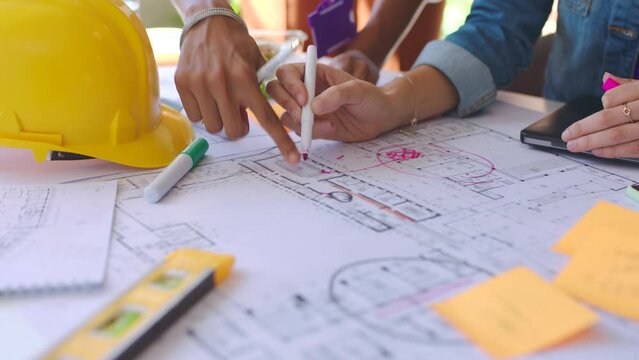Builder blueprint, engineering and architecture of a team development project in a office. Business construction, collaboration and teamwork workforce of engineer building staff group working