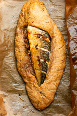 Mackerel or scomber baked in bread loaf
