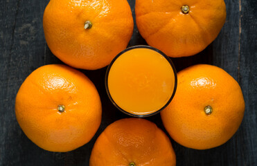 Fresh orange juice in the glass with orange fruit