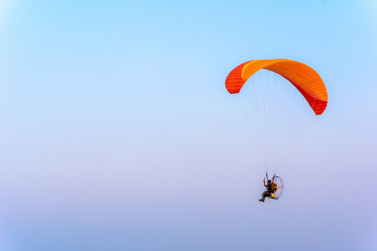 Paramotor flying on the sky, Paramotor flying on the sky ,adventure man active extreme sport pilot flying in sky with paramotor