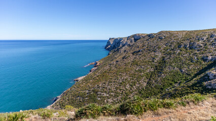 Fototapeta na wymiar Cliffs in the Mediterranean Sea in the south of Spain. White coast Spain. Valencian Community