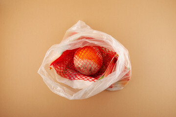 Spoiled Orange fruit in plastic bag. Concept - Improper storage of citrus fruits. Reduce organic...