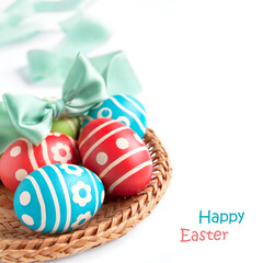 Easter eggs in the wicker plate isolated on white background