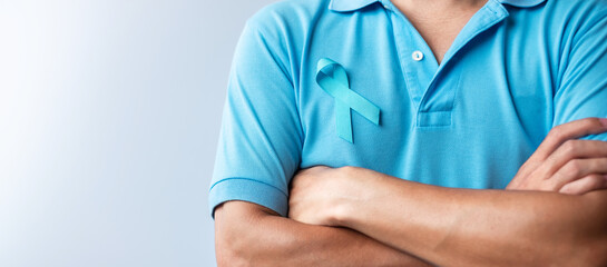 Blue November Prostate Cancer Awareness month, Man in blue shirt with Blue Ribbon for support...