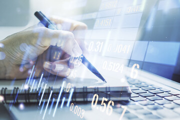 Multi exposure of abstract financial diagram with hand writing in notepad on background, banking and accounting concept