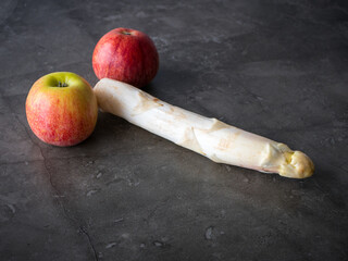 Two apples and an asparagus, concept for sexual virility and healthiness