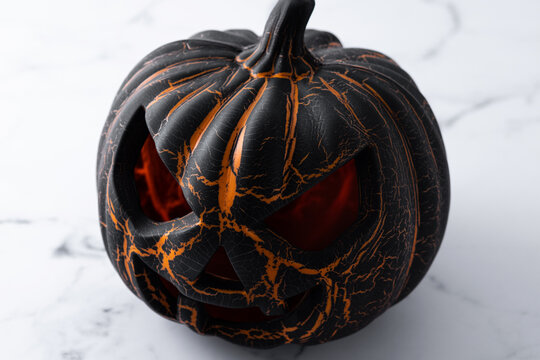 Black Halloween pumpkin on white background