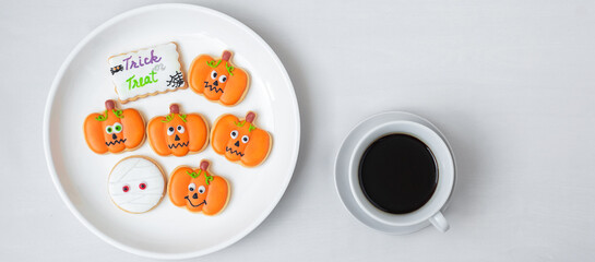 hot coffee cup with funny Halloween Cookies. Happy Halloween day, Trick or Threat, Hello October, fall autumn, Traditional, party and holiday concept