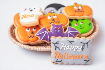 Halloween funny Cookies in wooden basket. Trick or Threat, Happy Halloween, Hello October, fall autumn, Festive, party and holiday concept