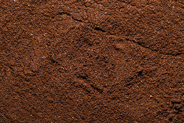Fresh, ground coffee, background texture.