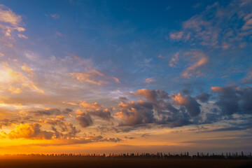 The dawn sky over the village. A wonderful morning landscape