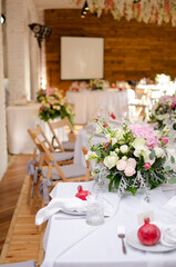 Beautiful wedding decoration. Banquet table setting and decoration. Flower decoration of wedding tables. Cutlery on the table.