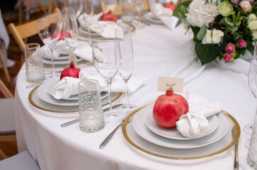 Beautiful wedding decoration. Banquet table setting and decoration. Flower decoration of wedding tables. Cutlery on the table.