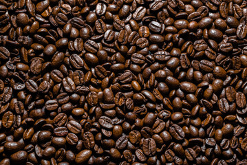Brown coffee beans background. Coffee beans, top view.