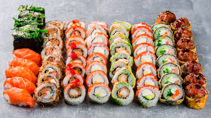 appetizing set of sushi roll on stone