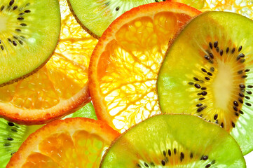 Sliced kiwi fruit and citrus orange on the white background