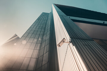 Outdoor street CCTV Security camera installed on the building wall in the city