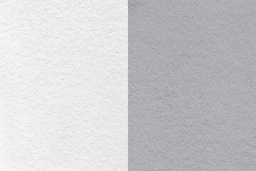 Fototapeta na wymiar Texture of craft white and gray paper background, half two colors, macro. Structure of vintage grey cardboard.