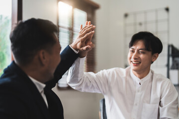 Achievement and Business Goal Success Concept - Business people with high five giving for business...