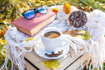 picnic with cup of coffee,latte,doughnut dessert with chocolate glaze,hot beverages in park,garden